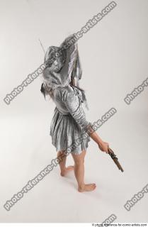 2020 01 LUCI AVIOL STANDING POSE WITH GUN AND SWORD…